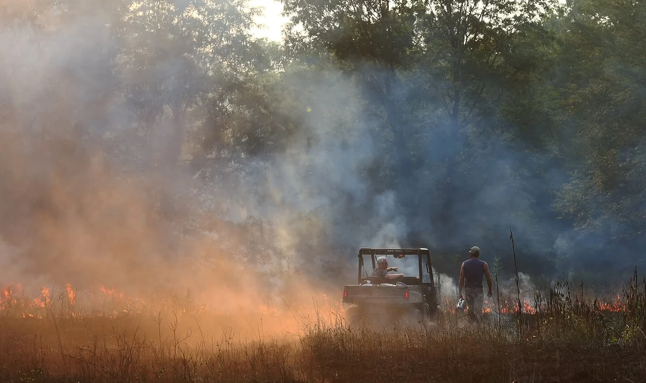 Kaleb running a prescribed burn on a whitetail property